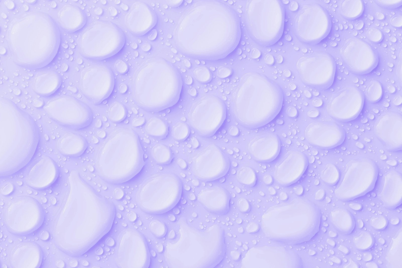 Close-up of water droplets on a lavender background, perfect for use as an abstract wallpaper.